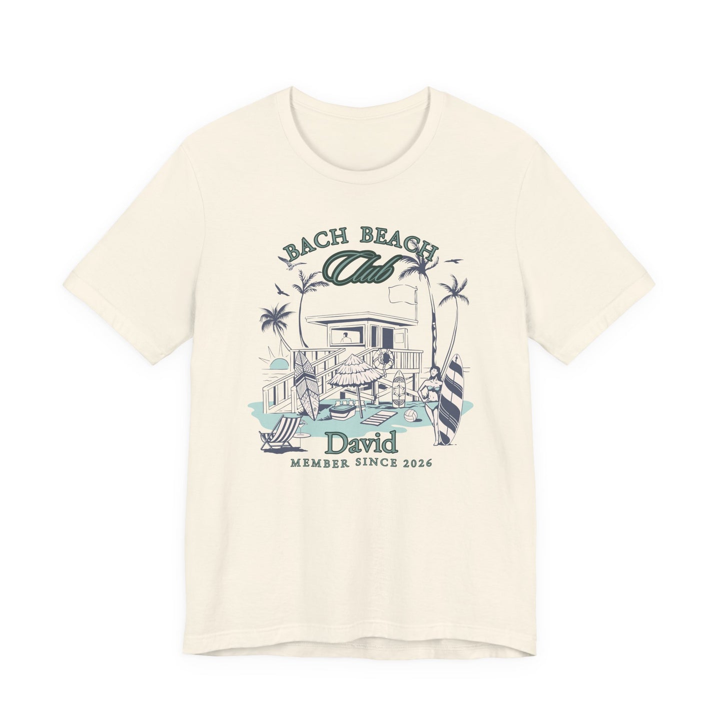 Personalized Bella + Canvas 3001 t-shirt in natural featuring a retro beach bachelor party design with palm trees, surfboards, beach house artwork, custom name text, and “Bach Beach Club Member Since 2026” wording in coastal green and blue lettering.
