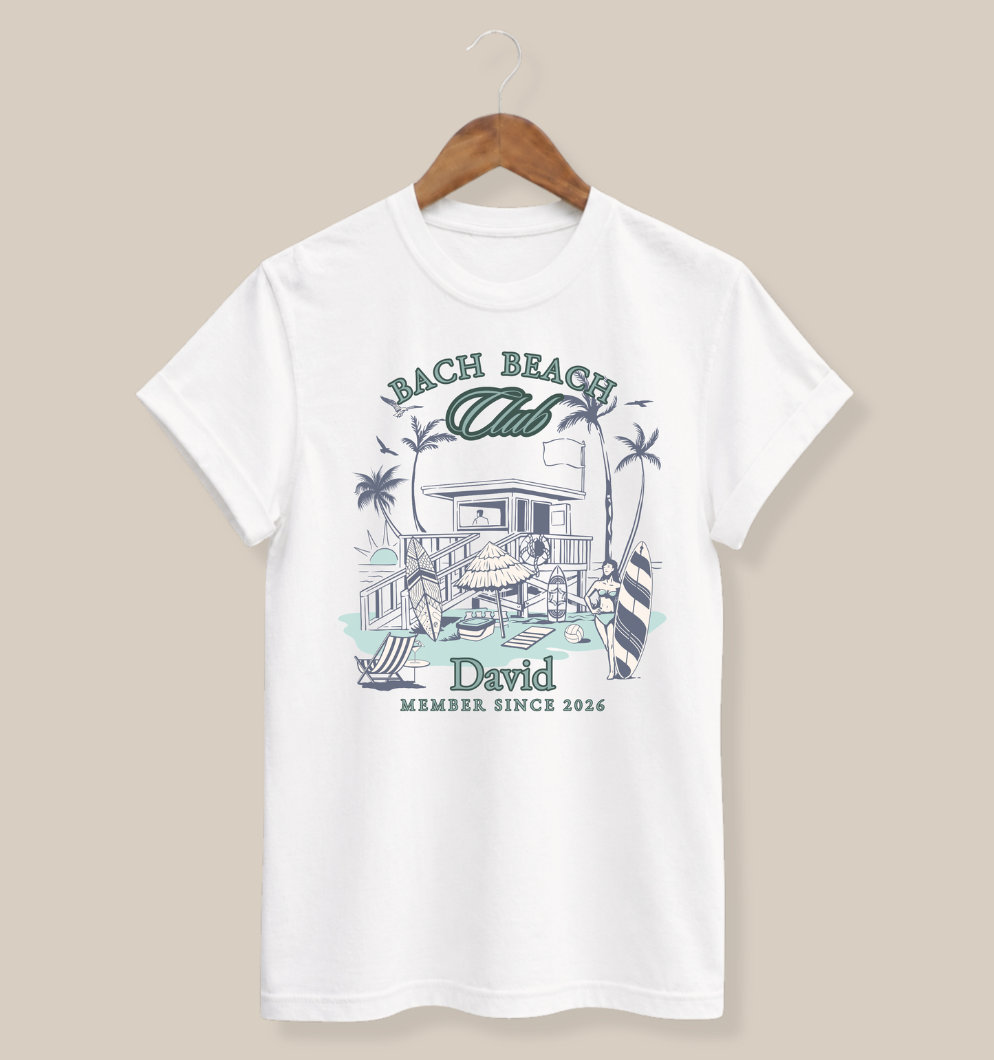 Personalized Bella + Canvas 3001 t-shirt in white featuring a retro beach bachelor party design with palm trees, surfboards, beach house artwork, custom name text, and “Bach Beach Club Member Since 2026” wording in coastal green and blue lettering.