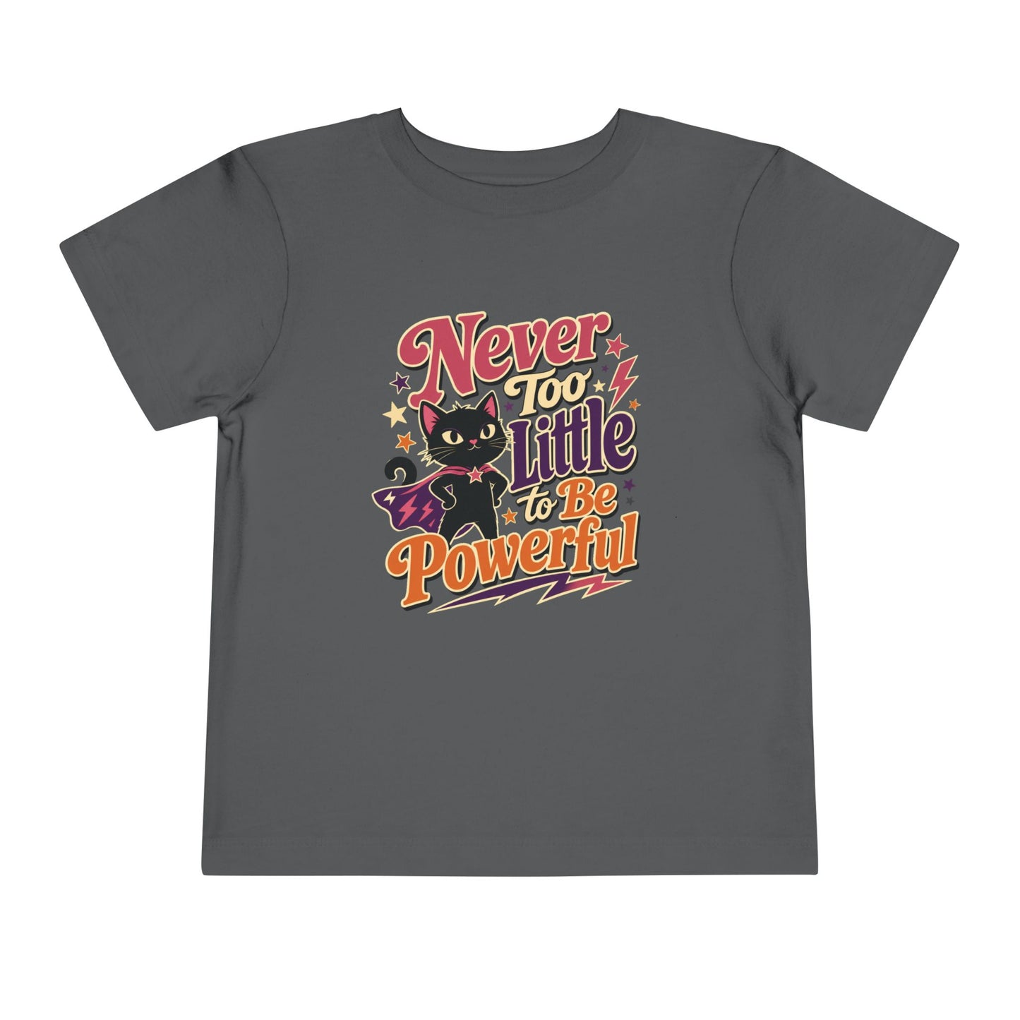 Asphalt grey color toddler T-shirt featuring a superhero black cat in a purple cape surrounded by colorful stars and the empowering phrase “Never Too Little to Be Powerful.”