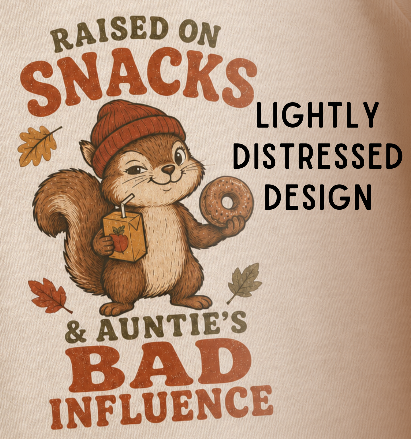 Close-up of a natural baby one piece featuring a squirrel holding a donut and juice box, autumn leaves, and the phrase “Raised on Snacks & Auntie’s Bad Influence.”