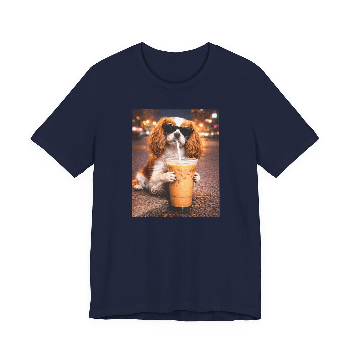 navy blue graphic t-shirt featuring a cavalier king charles spaniel in sunglasses holding an iced coffee on a city street background