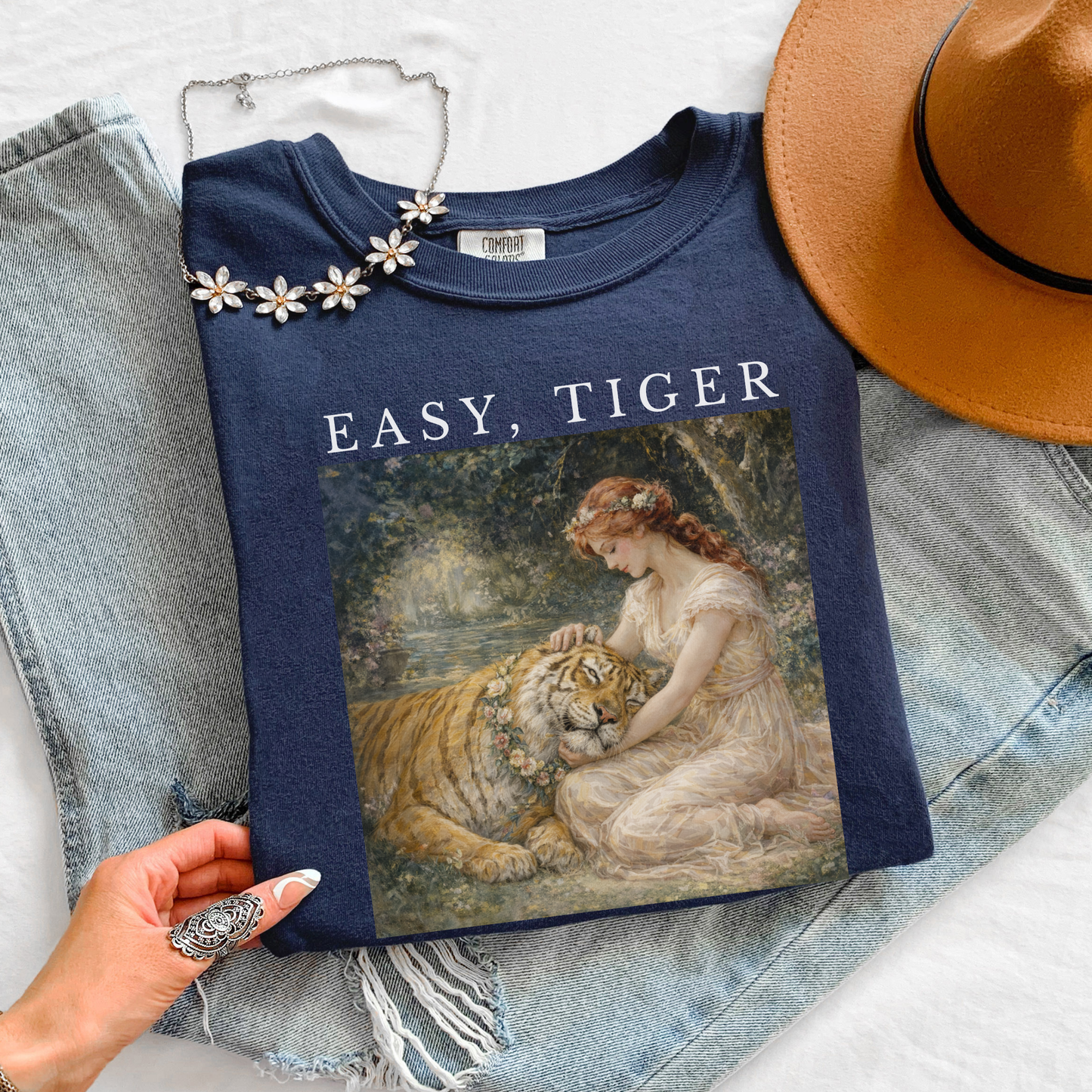 navy “Easy, Tiger” graphic tee flat lay styled outfit with boho accessories and vintage tiger design