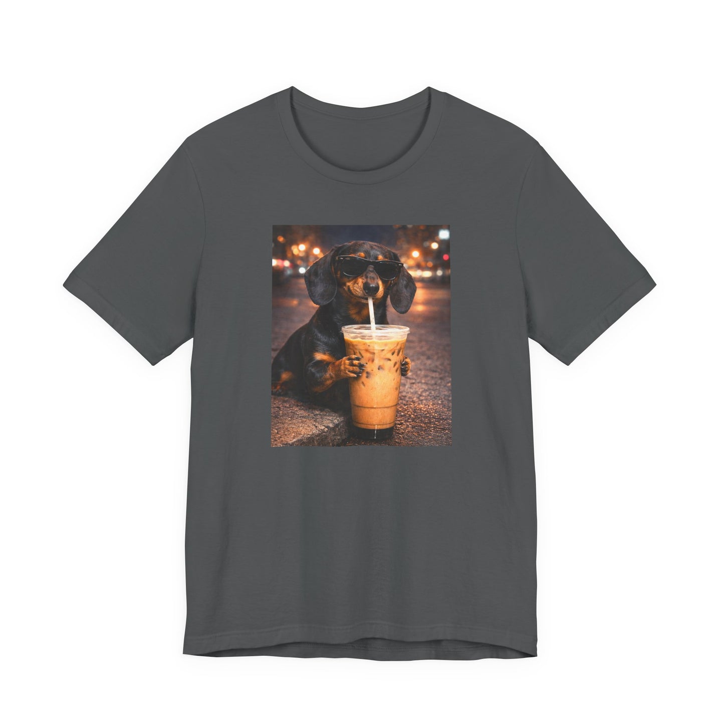 asphalt graphic t-shirt featuring a dachshund dog in sunglasses drinking iced coffee on a nighttime street background