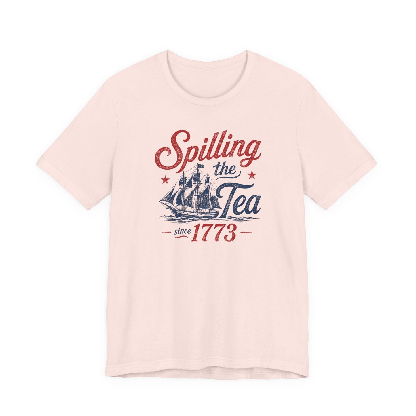 light pink bella canvas 3001 fourth of july graphic tee featuring spilling the tea since 1773 quote with distressed red and navy colonial ship artwork inspired by the boston tea party