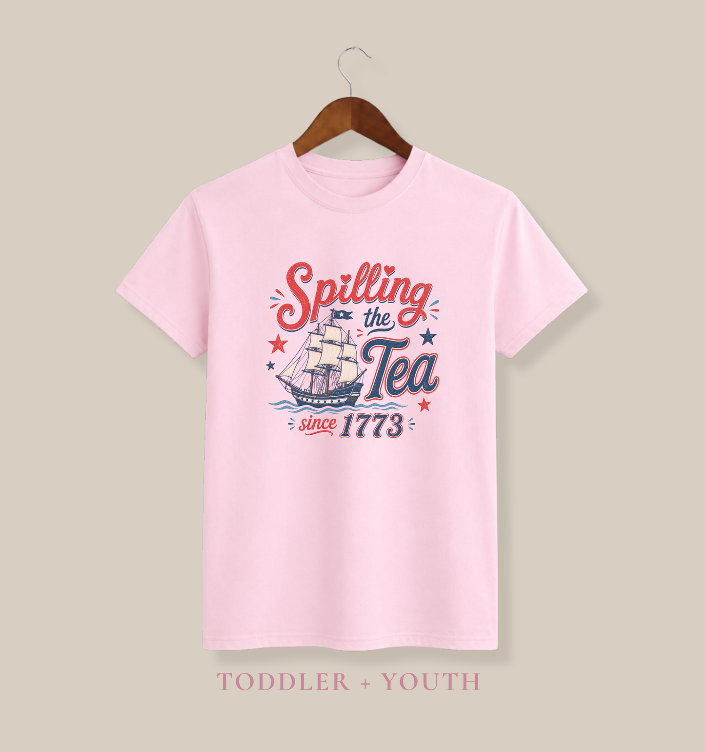 toddler fourth of july graphic tee in light pink featuring spilling the tea since 1773 slogan with patriotic sailing ship artwork in red and blue vintage style